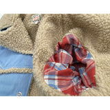 Faux shearling fur body lining, 100% acrylic pile fabric, aka “sherpa” and woven plaid cotton flannel fabric arm lining.