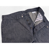 Inspired by European casual 1950s-60s fashion, with period French cinema references. Merging slacks and denim. Frogmouth front pockets and snap button waistband.