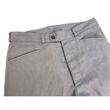 Detail view of the Nouvelle Vague Slacks with Frogmouth front pockets and snap button waistband.